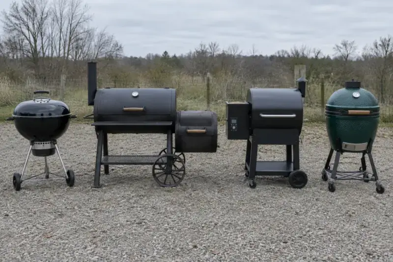 Kettle grill, offset smoker, pellet grill and kamado lined up side by side